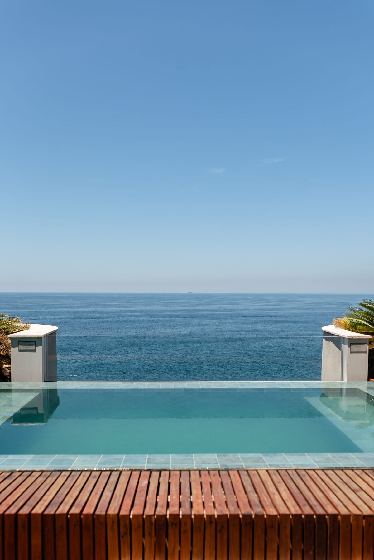Private plunge pool set on a terrace with an uninterrupted ocean view